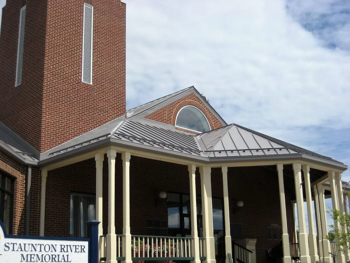 Skilled roofing craftsmen working on a residential roof in Fredericktown